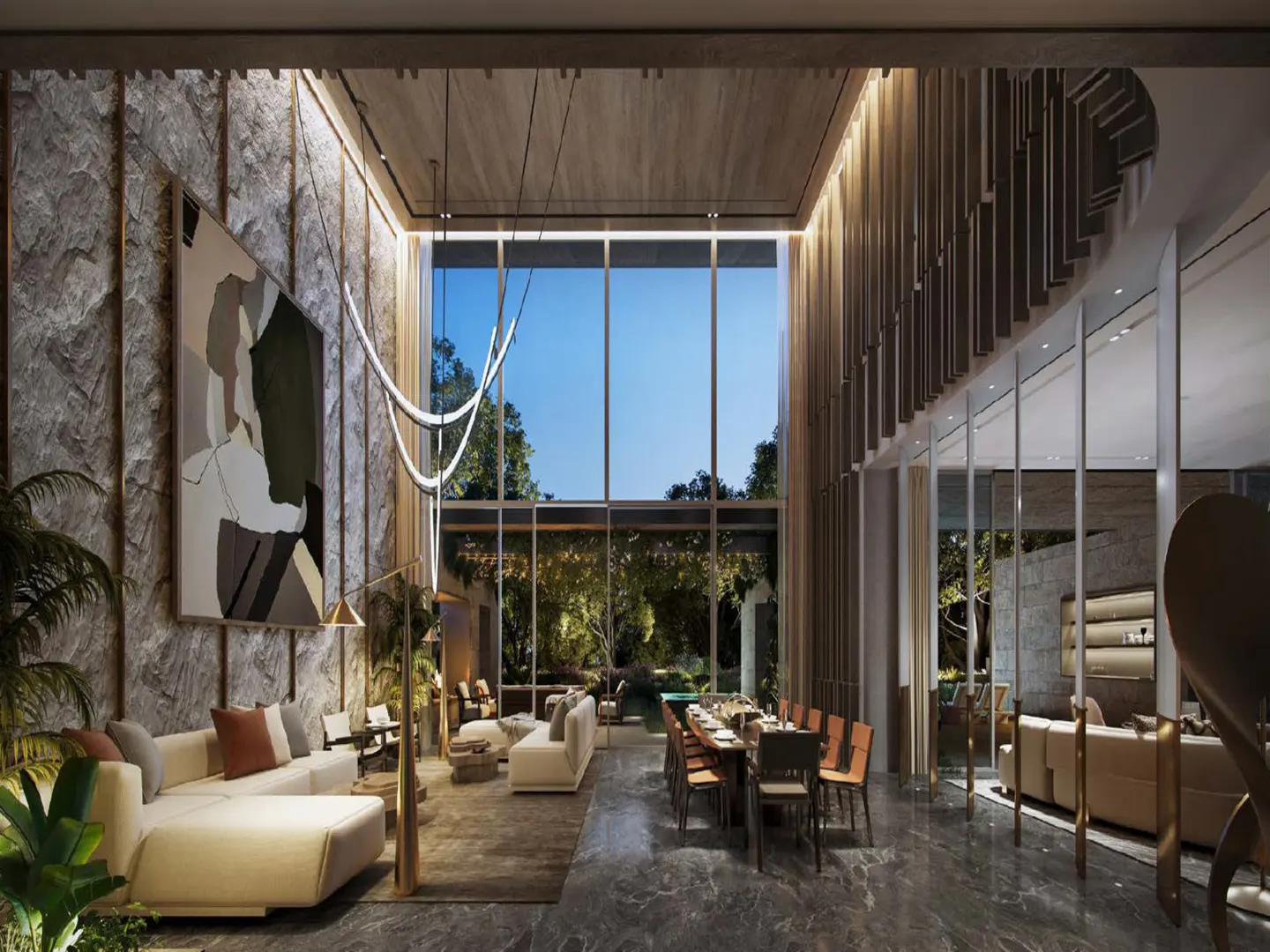 A modern living room with a high ceiling, large windows, and a view of a lush garden. A long dining table and a white sofa are visible.