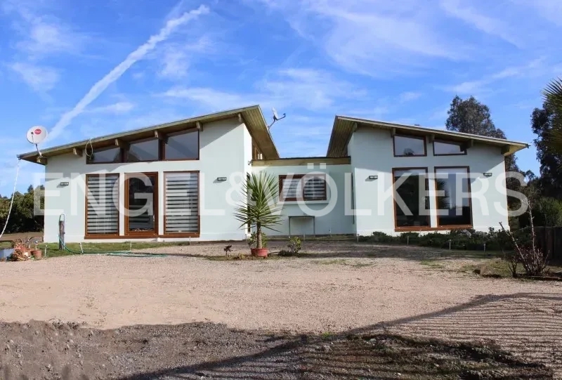 Agradable parcela con casa y paltos en producción