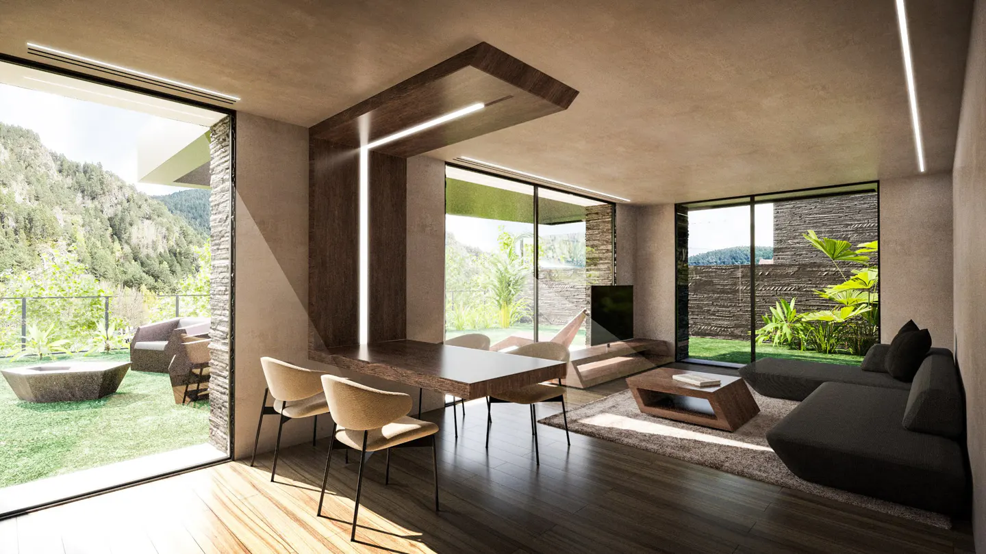 A modern living room with a dining table, chairs, and a gray sofa. Large windows offer views of a green lawn and mountains.