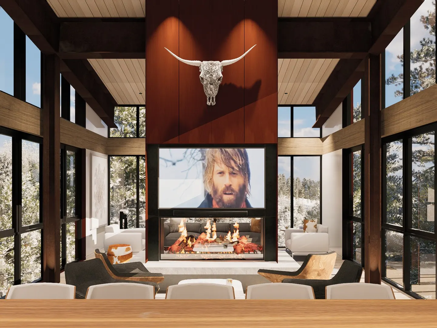 Living room with a fireplace, TV, and a bull skull on the wall. Large windows show a snowy landscape.