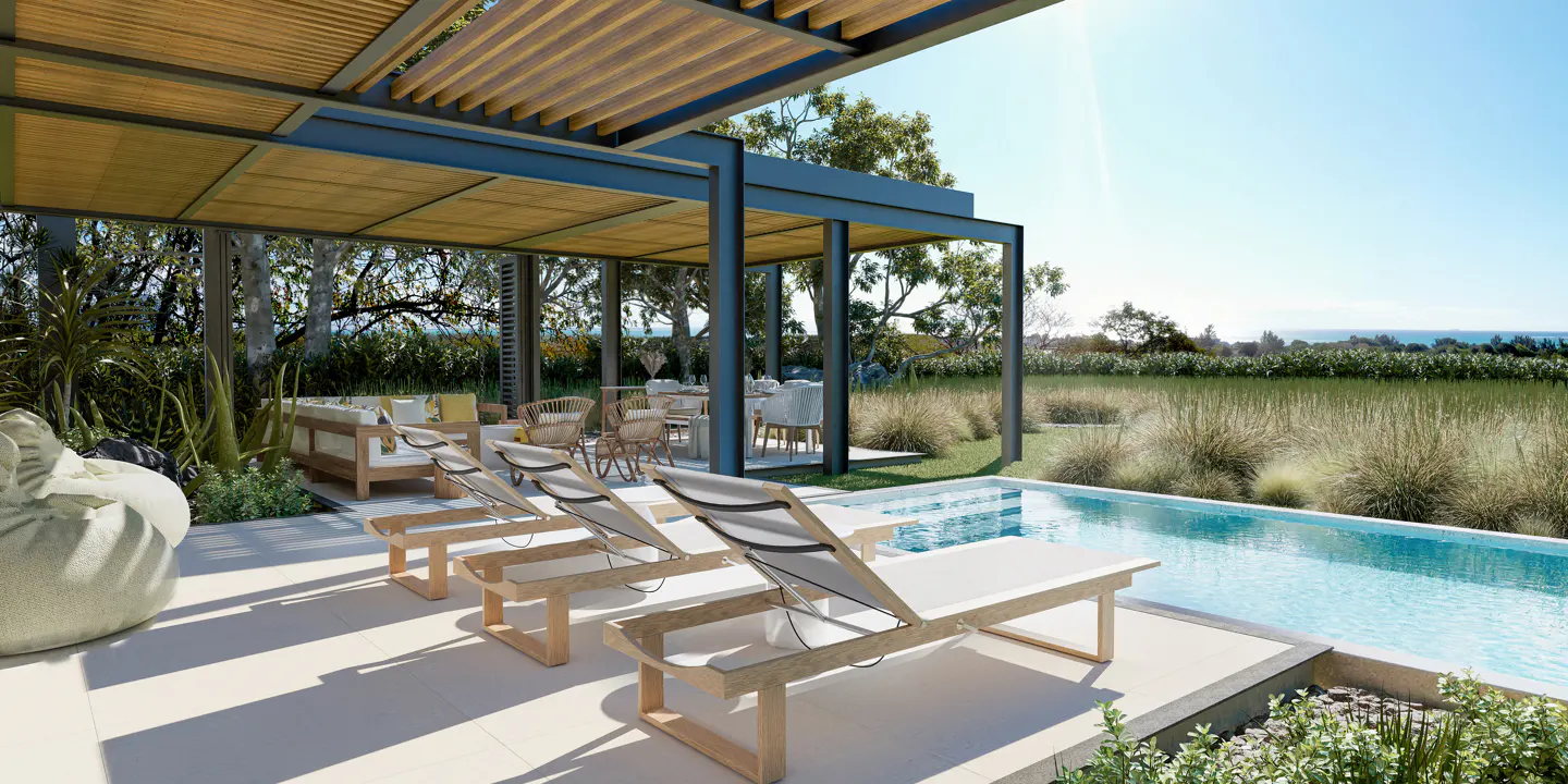 Outdoor patio with a pool, lounge chairs, and a pergola. Table and chairs are visible in the background.