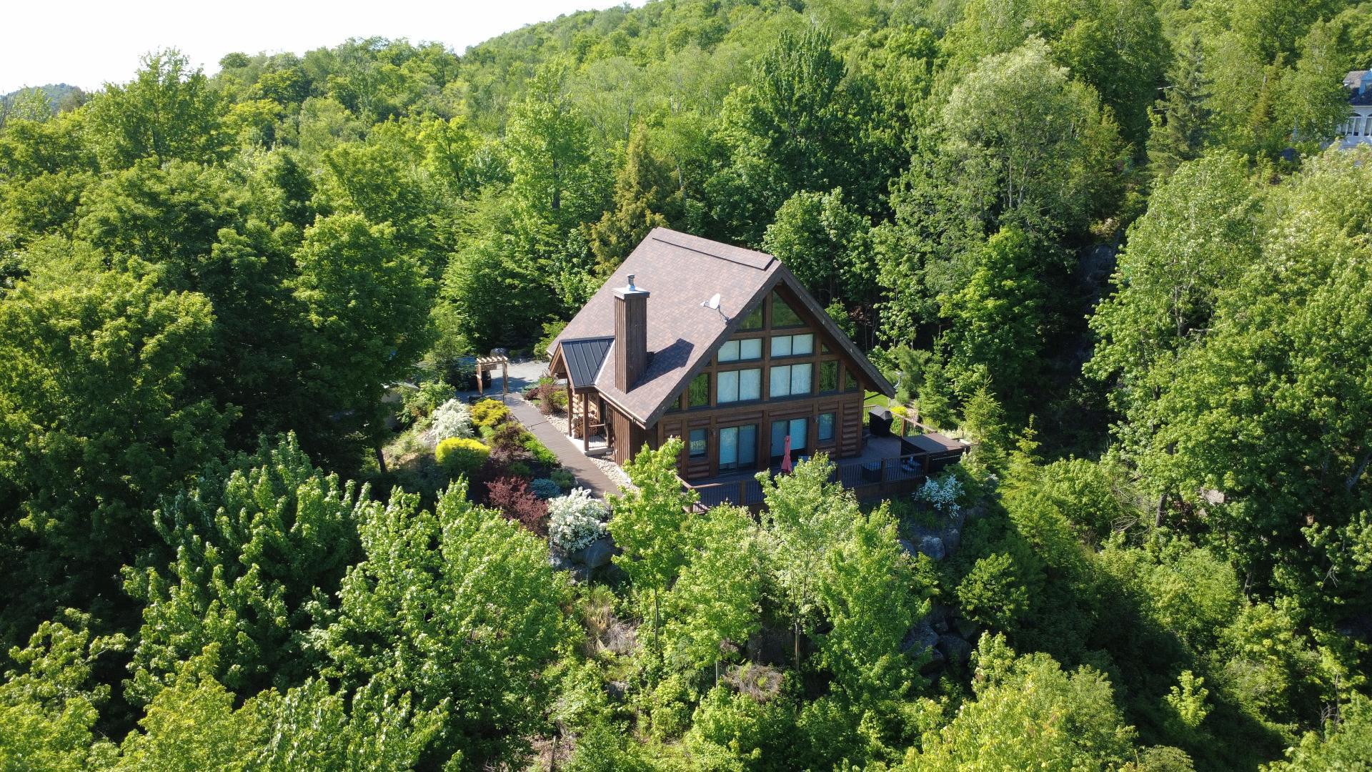 Magnificent log property offers breathtaking views.