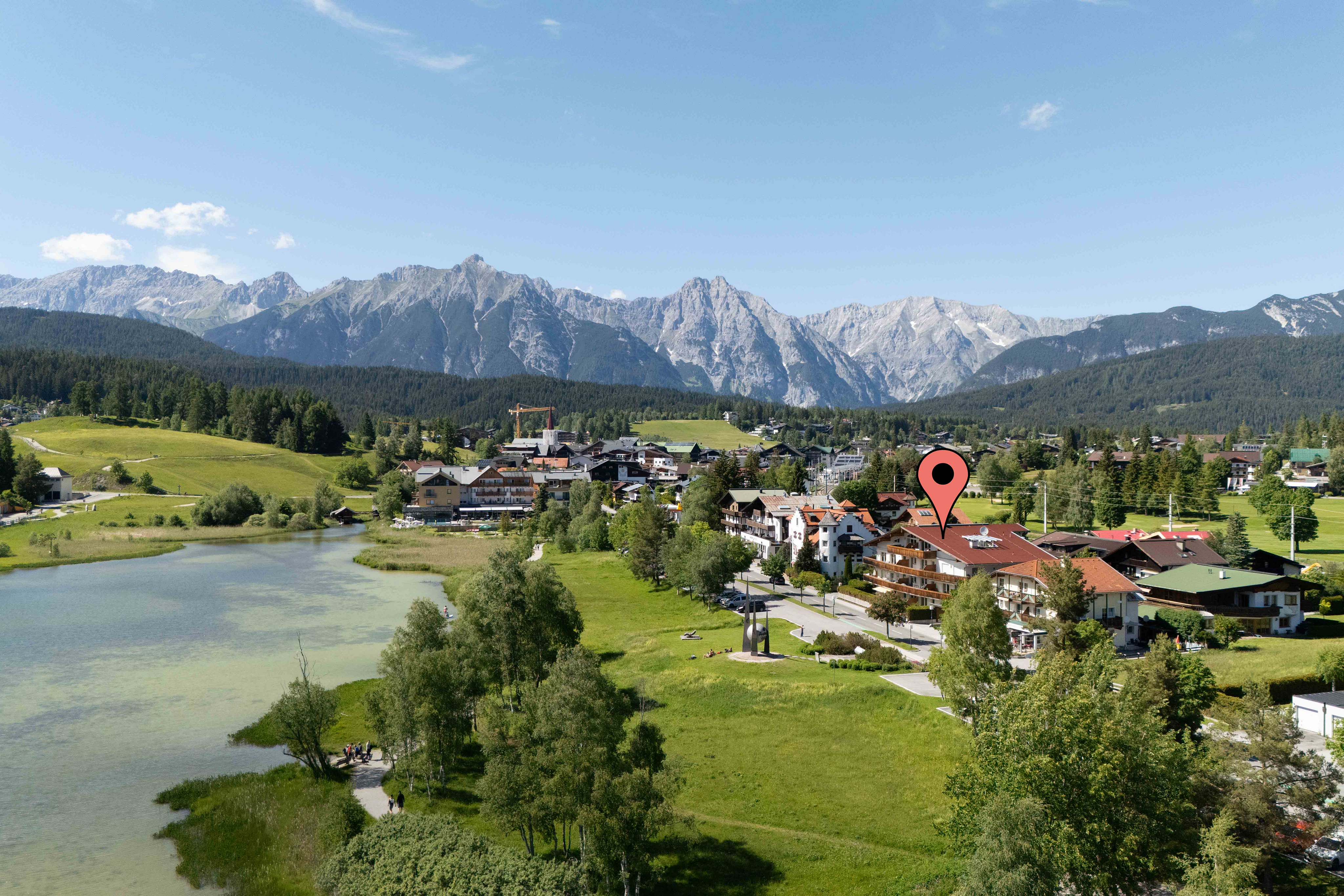 Premium lakeside living with 3 bedrooms, a private garden & underground parking
