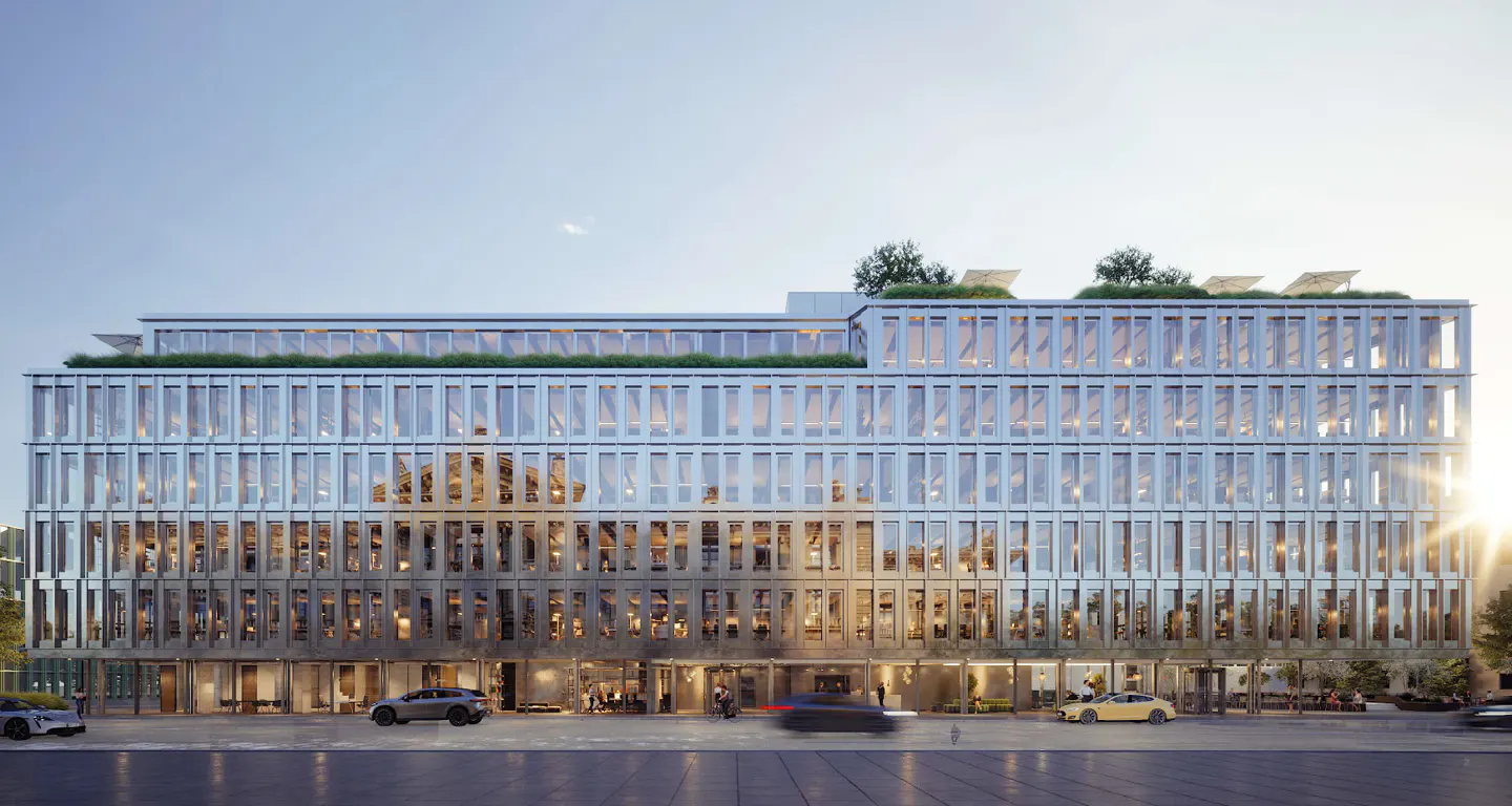 Modern office building with glass facade, rooftop garden, and cars parked in front.