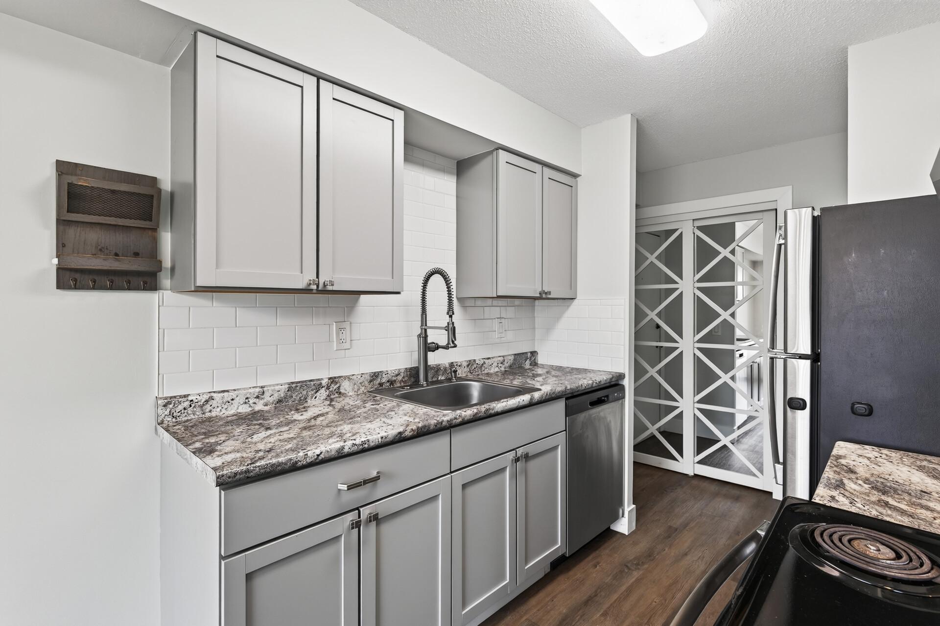 Updated Main-Level Condo with Patio & Assigned Parking