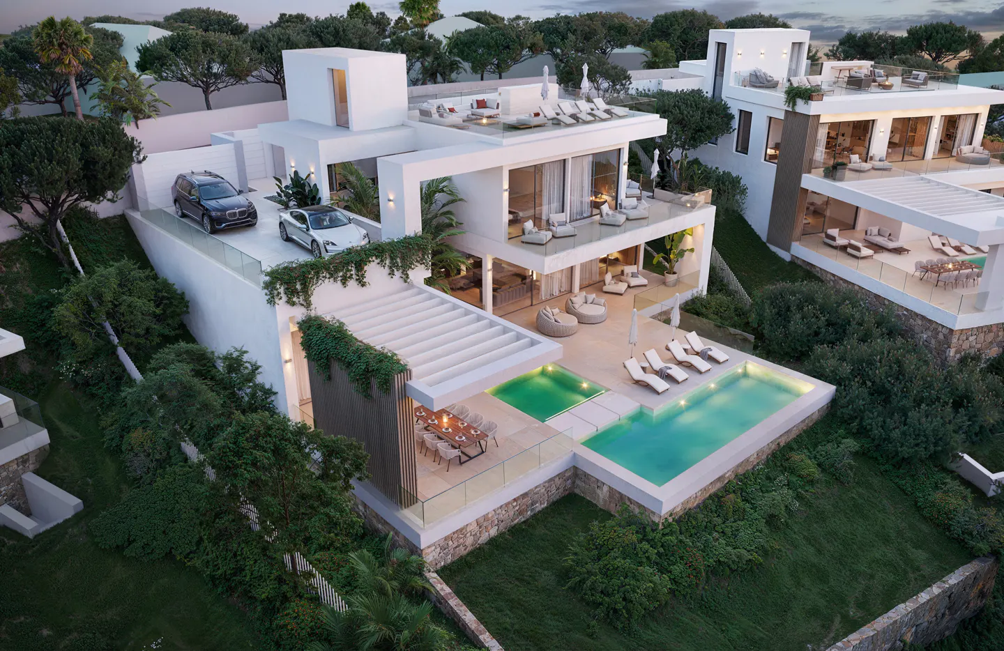 Aerial view of a modern white villa with a pool, patio, rooftop terrace, and two cars parked on the roof. Lush green landscaping surrounds the property.