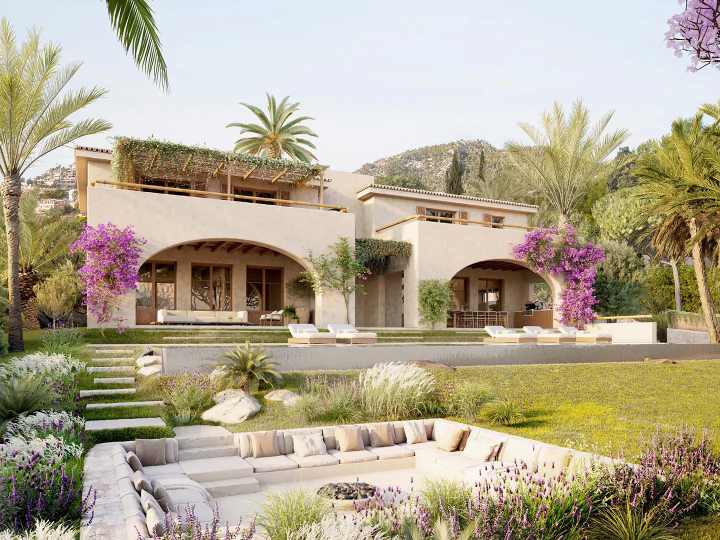 Beige two-story house with arched openings, purple flowers, and a sunken seating area with cushions and a fire pit. Palm trees and greenery surround the house.
