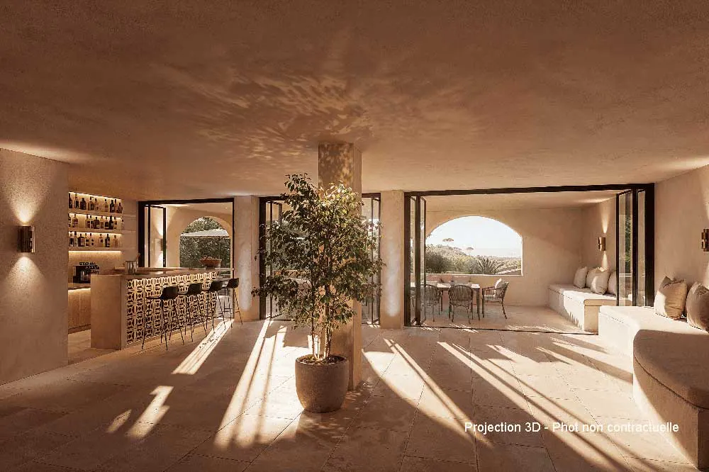 Beige interior with bar, seating, and open patio. A potted tree stands near a support column. Sunlight streams in through open doors.