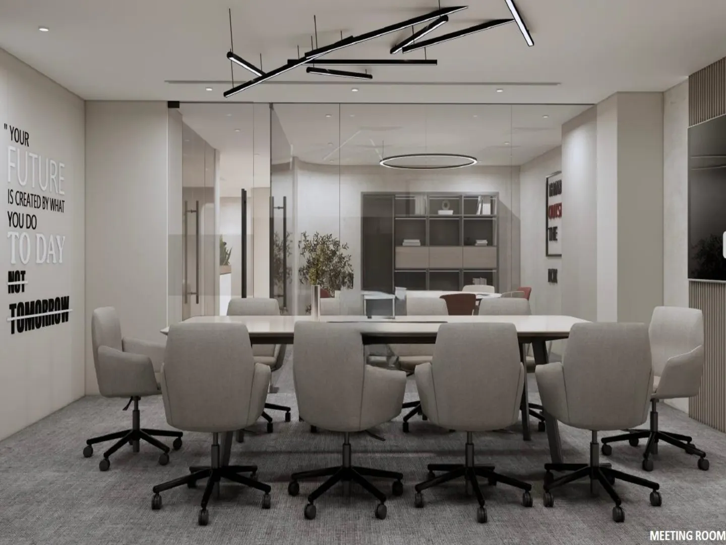 A modern conference room with a long table, gray chairs, and a glass wall. A quote is on the wall.