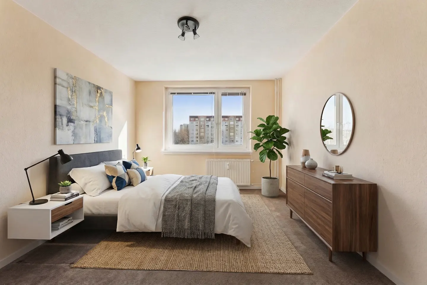 Bedroom with a bed, nightstand, dresser, and jute rug. A window overlooks a building. Walls are light peach.