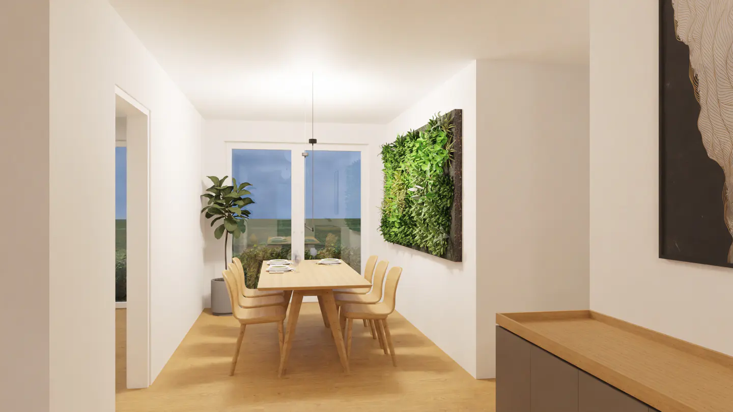Bright dining room with a light wood table and chairs, a green wall panel, and a large window overlooking a garden.