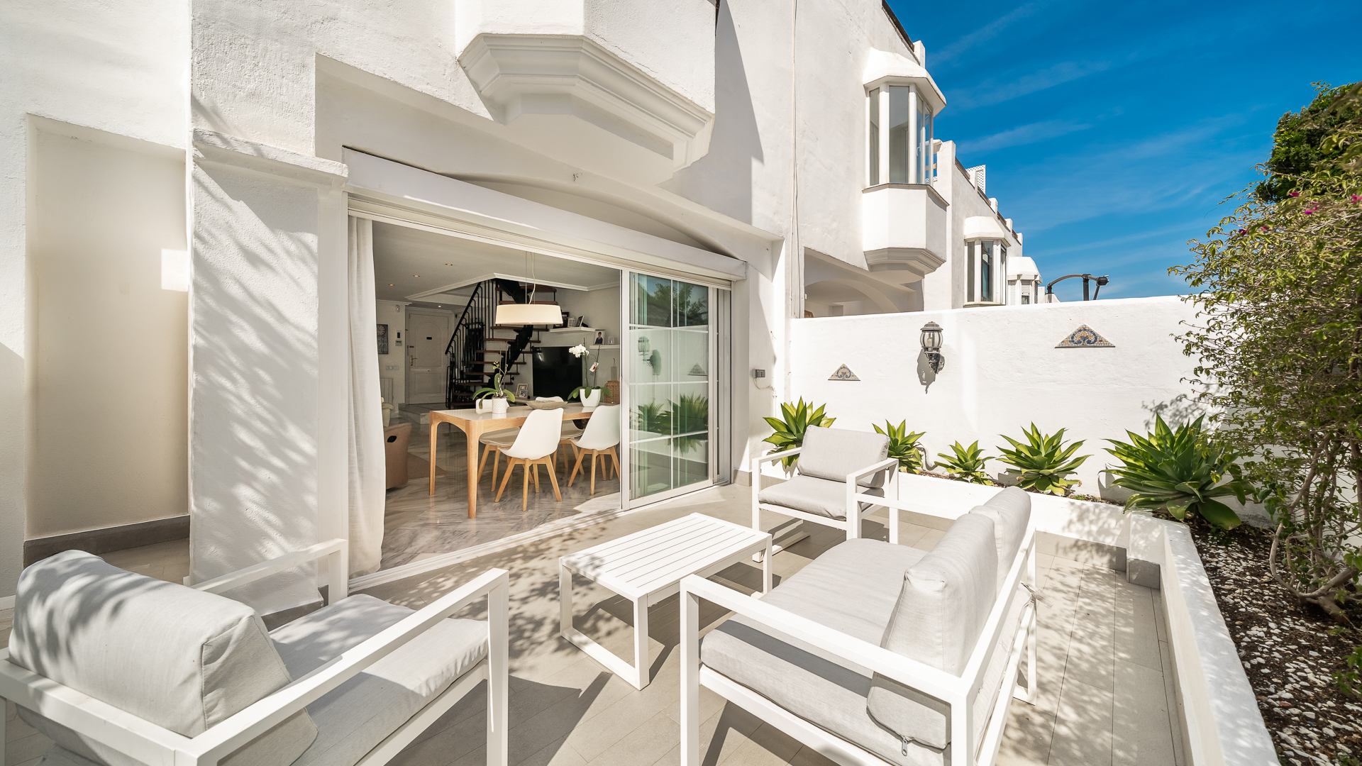 Exclusive Corner Townhouse with Expansive Private Terraces Steps from Puente Romano