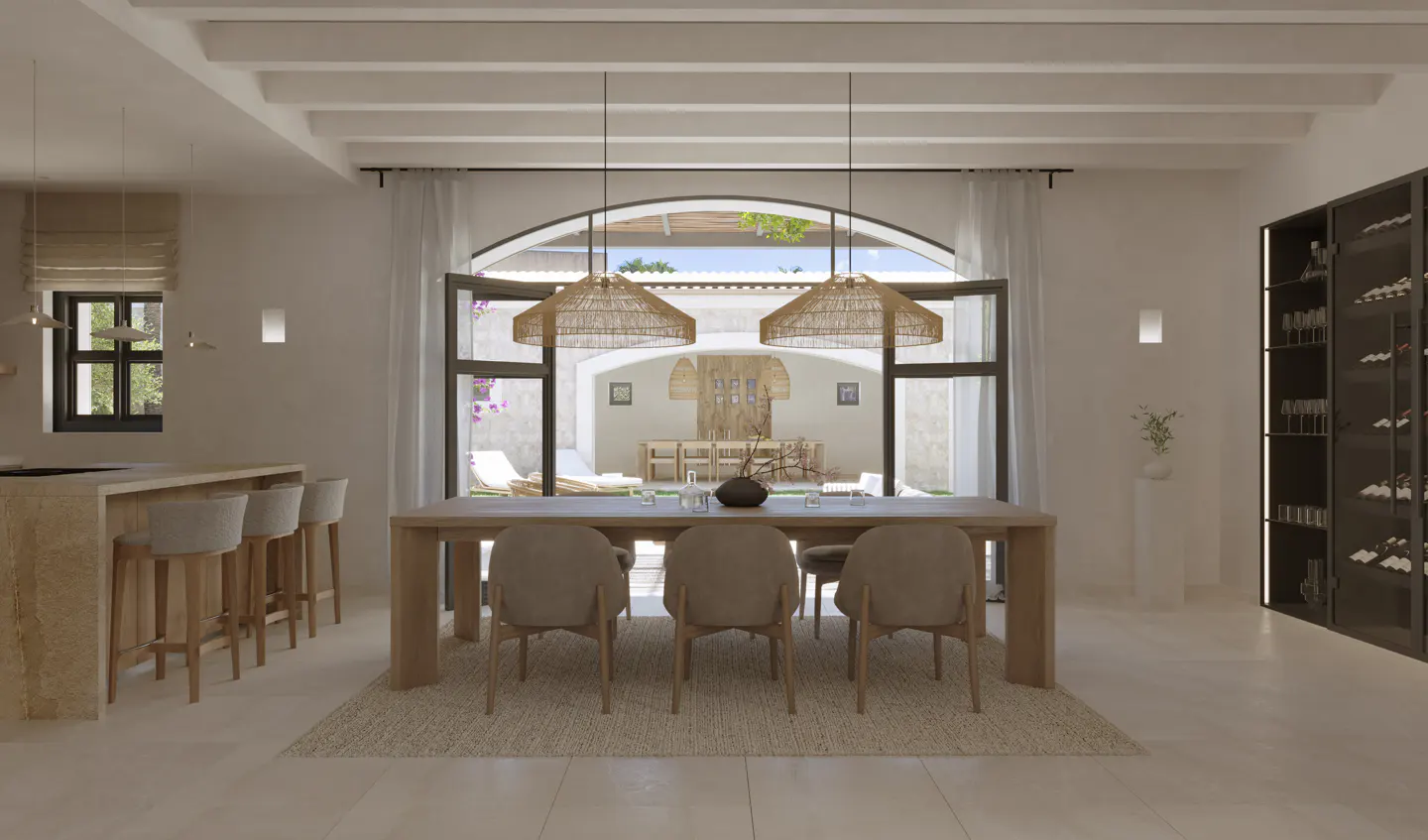 A bright dining room with a long wooden table and six chairs, lit by two woven pendant lights. An arched doorway leads to an outdoor patio.