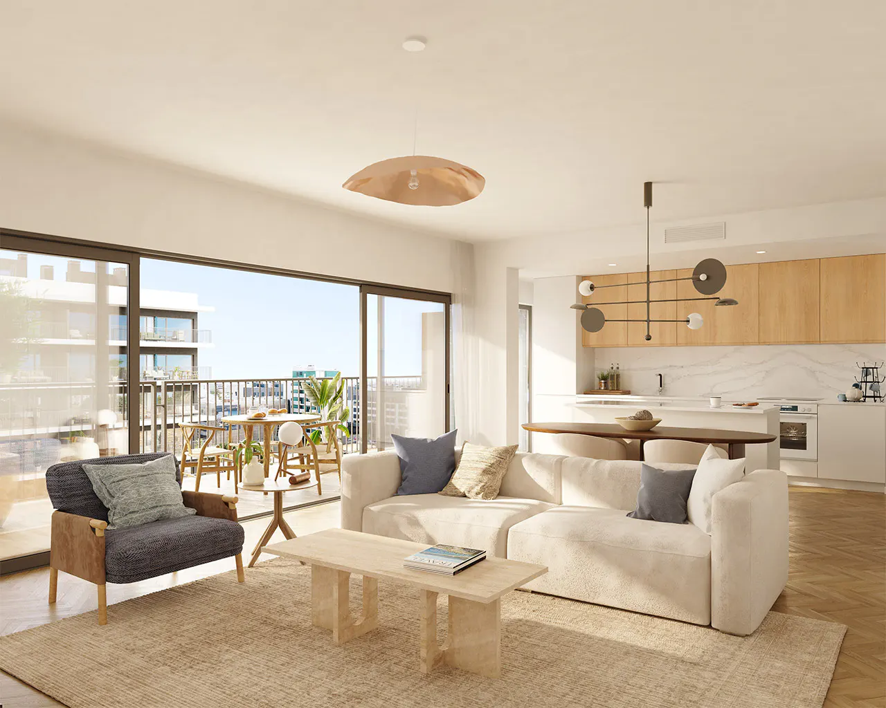 Bright, open-concept living space with a cream sofa, wood floors, and a balcony with outdoor seating. Modern kitchen in the background.