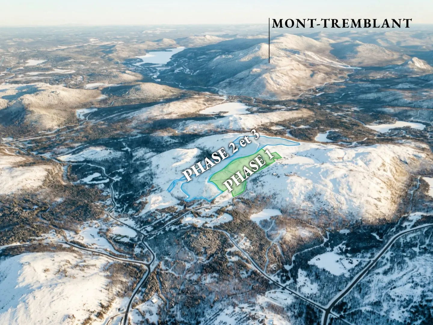 Aerial view of a snowy, mountainous landscape with designated real estate phases. Phase 1 is green, and Phases 2 and 3 are blue. Mont-Tremblant is in the background.