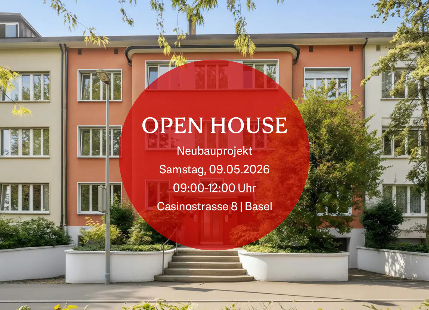 Open house sign on a three-story building with beige and orange facade, trees, and stairs leading to the entrance.