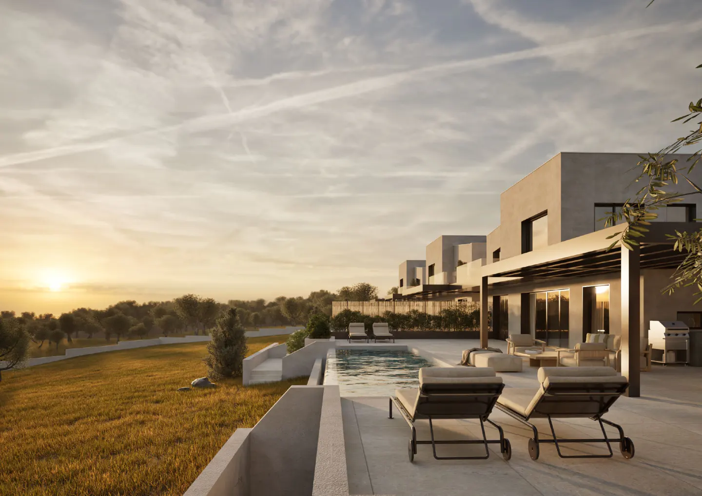 Modern home exterior with a pool, lounge chairs, and a grassy lawn at sunset.