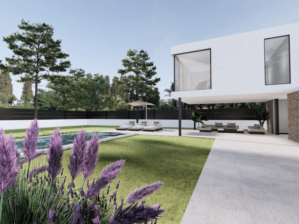Modern white house with a pool, green lawn, and purple pampas grass in the foreground. Lounge chairs and trees are visible in the background.