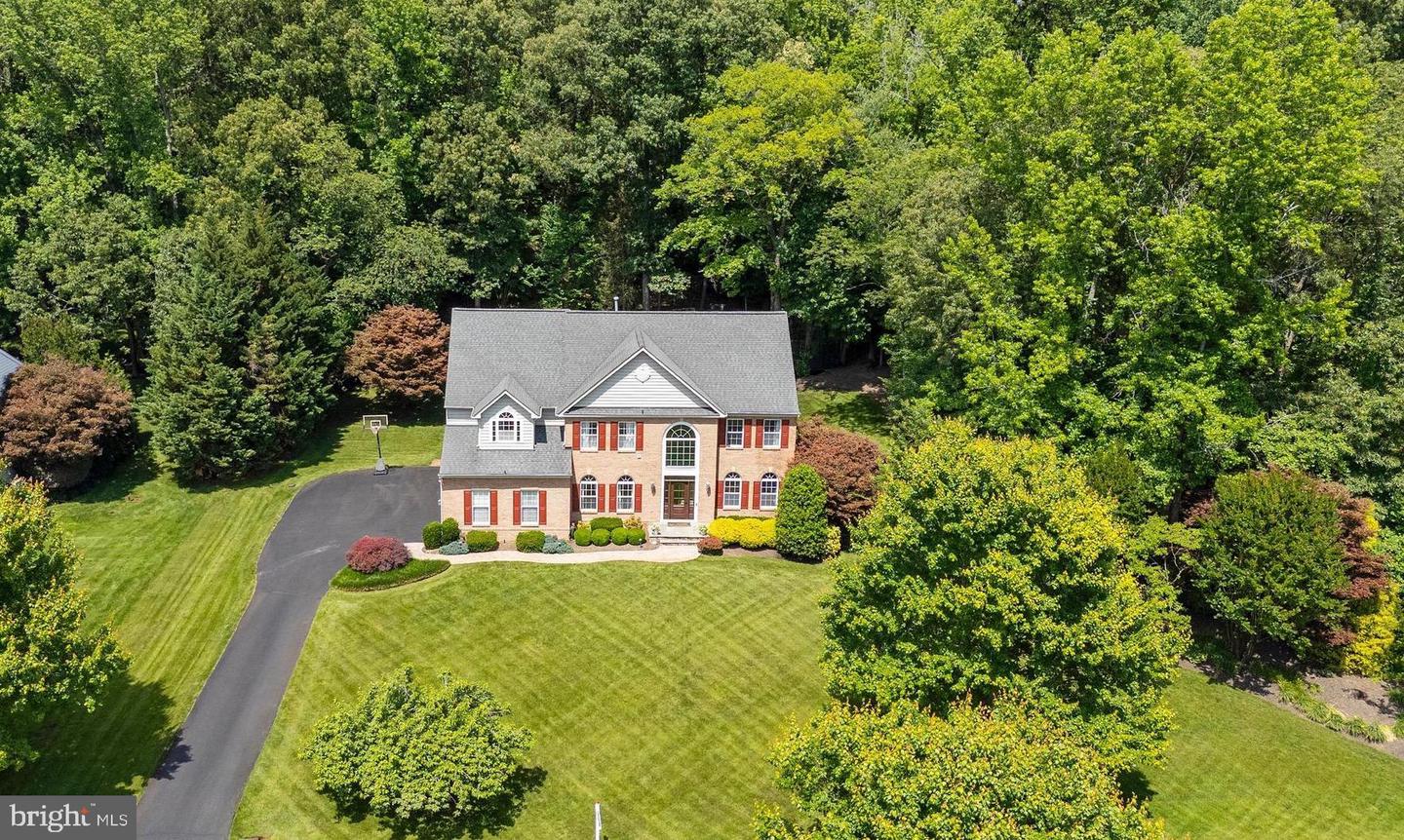 Classic Brick-Front Colonial with Exceptional Outdoor Living