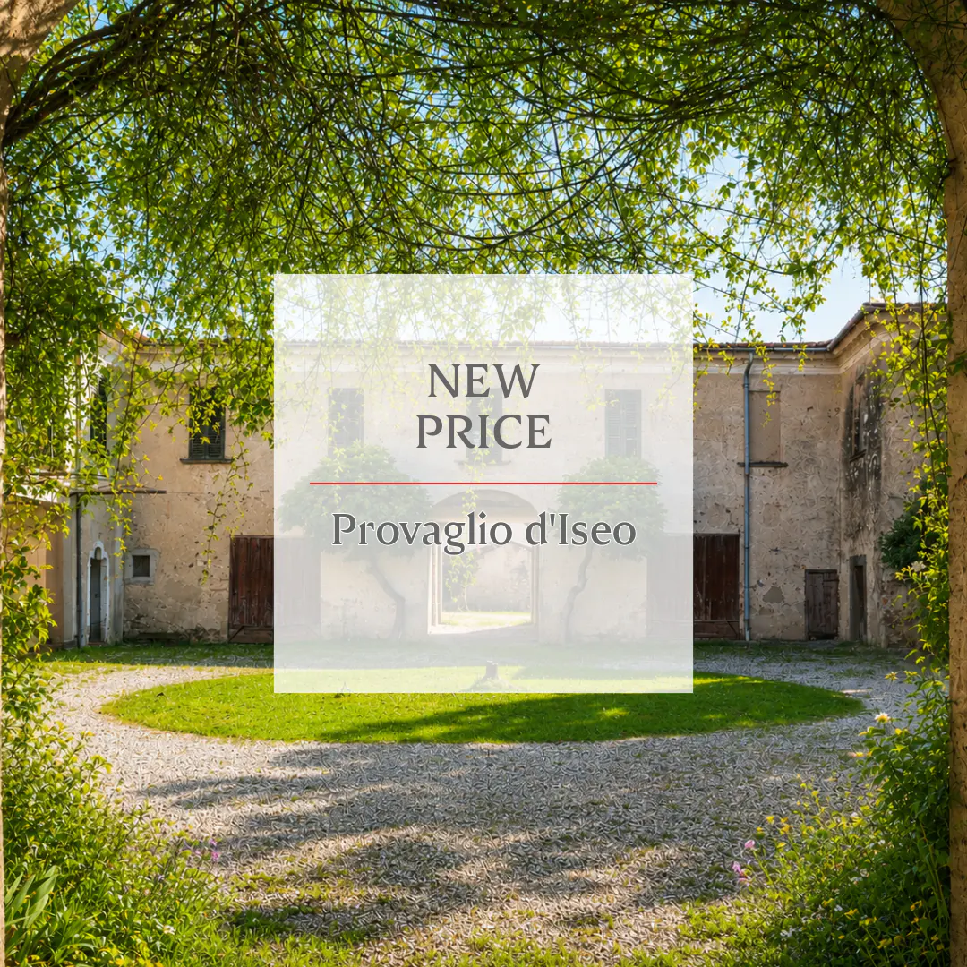Exterior view of a stone building with "New Price Provaglio d'Iseo" text overlay, framed by green trees and foliage.