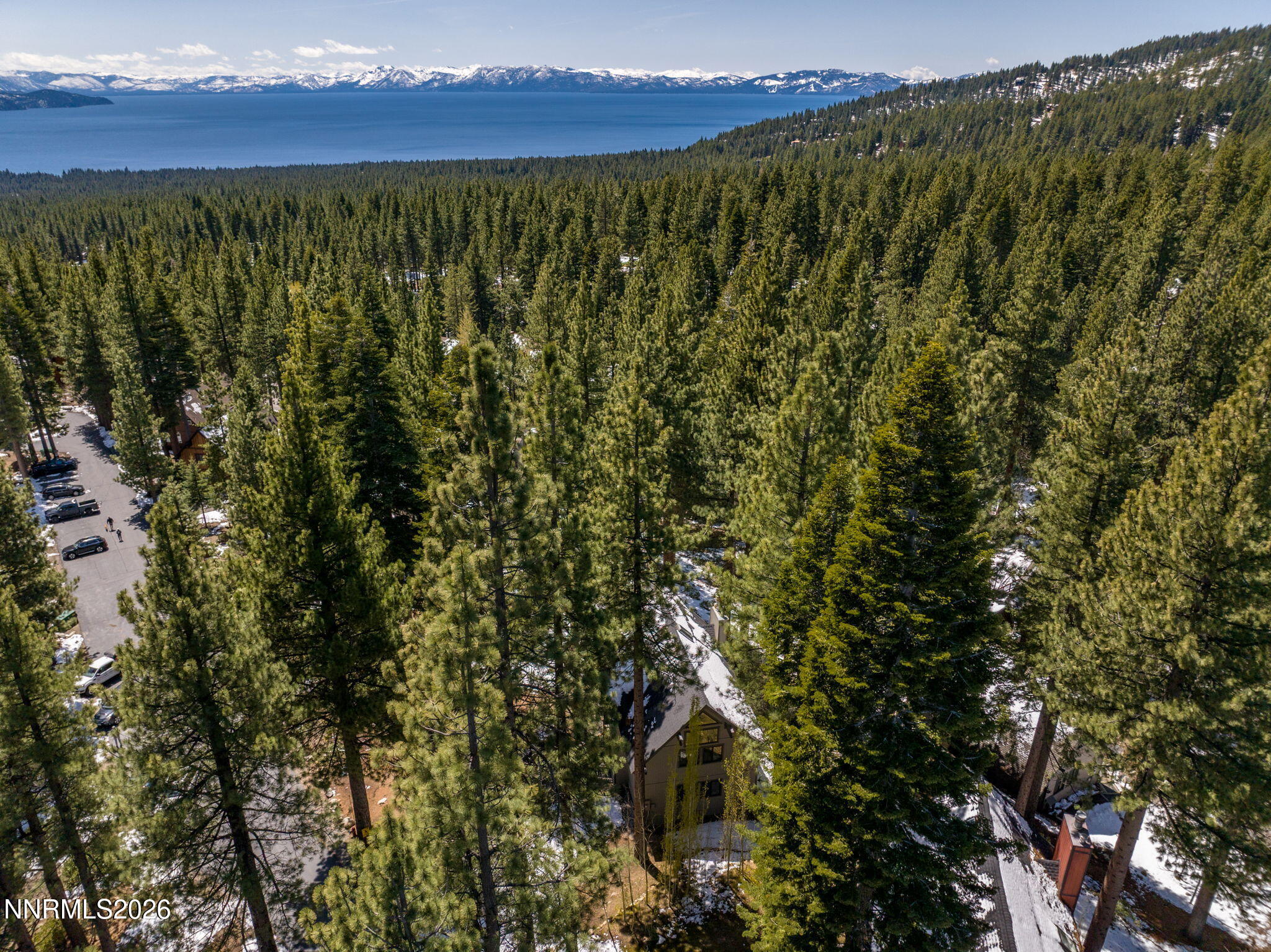 Located at the end of a forested cul-de-sac with lake views.