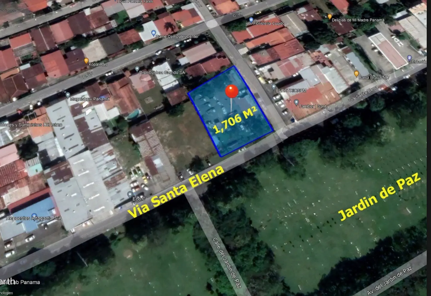 Aerial view of a 1,706 m² lot outlined in blue, marked with a red pin, near Via Santa Elena and Jardin de Paz in Panama.