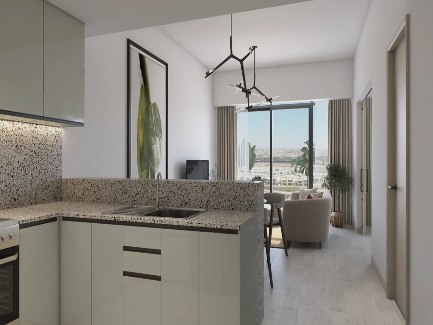 A modern apartment interior featuring a kitchen with light green cabinets and a speckled countertop, opening to a living area with a large window view.