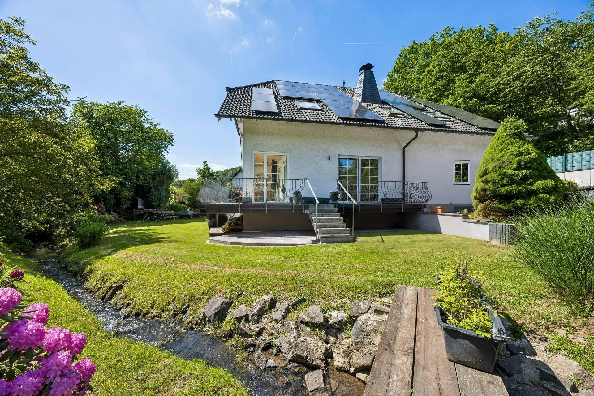 Fairytale living bliss with your own stream [AI-modified]