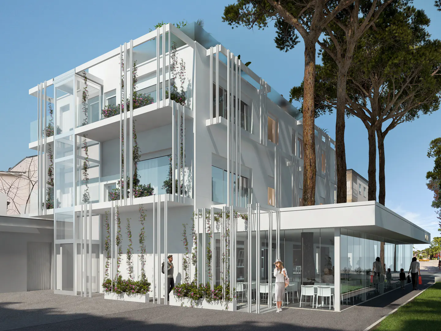Modern white building with glass balconies and vertical white slats. Vines and flowers adorn the facade. People walk outside a glass-enclosed cafe area.