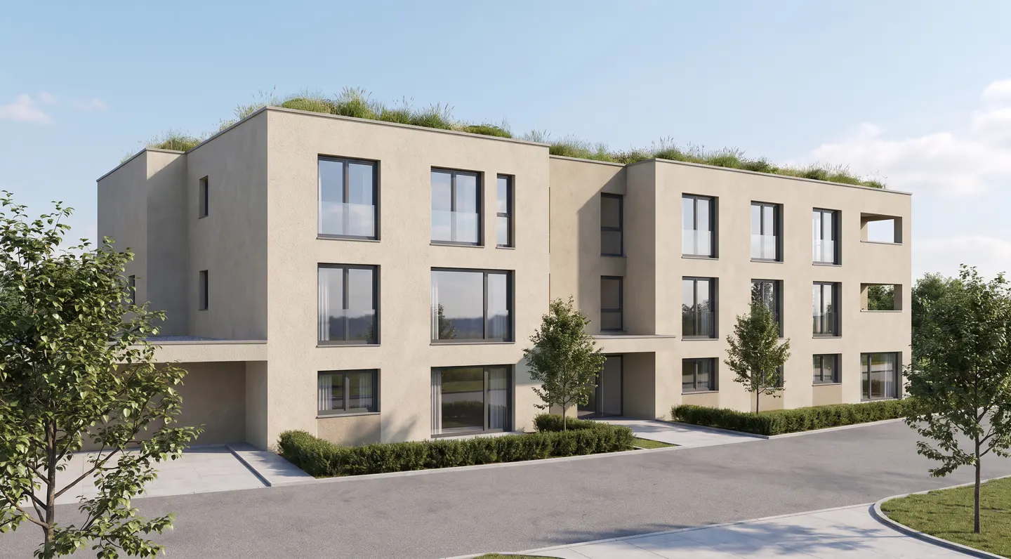 Modern beige apartment building with a green roof, large windows, and landscaped hedges under a clear blue sky.