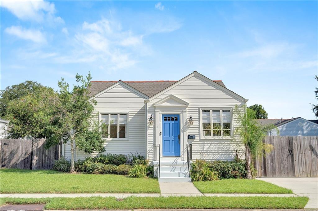 Old Jefferson Cottage on Tree Lined Street