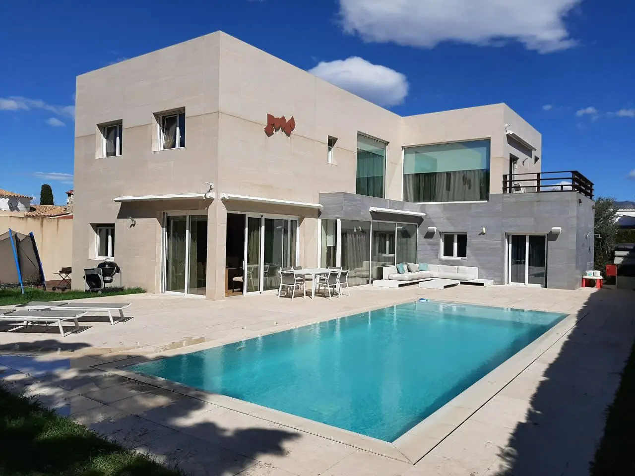 Large modern house with pool in the center
