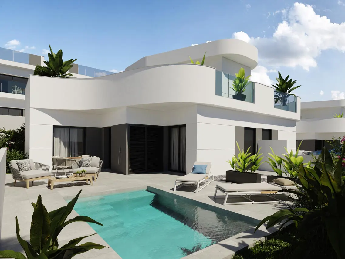 Modern white villa with a turquoise pool, lounge chairs, and outdoor seating under a blue sky with clouds.