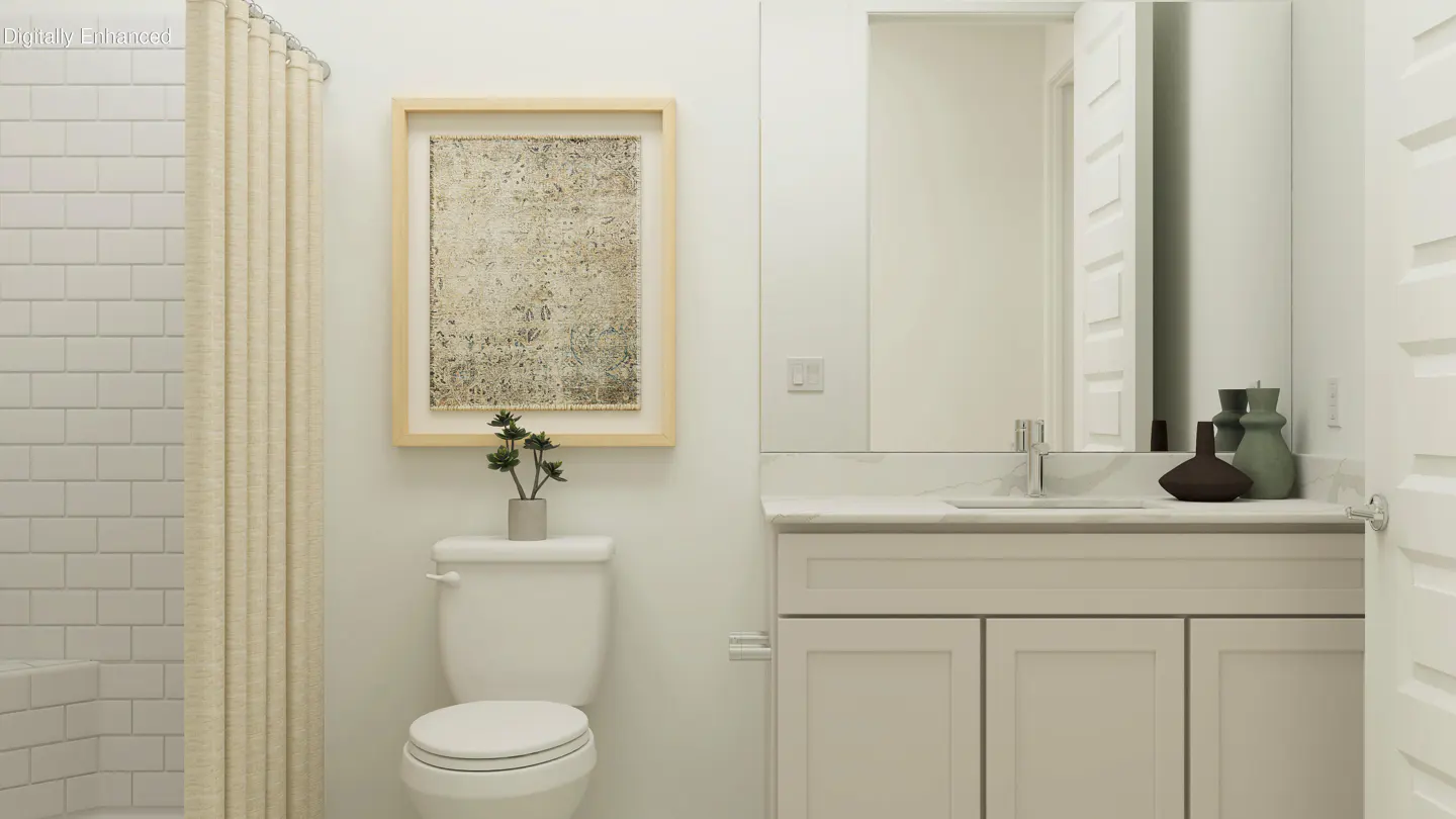 A bright bathroom with white subway tiles, a beige shower curtain, a toilet, and a vanity with a mirror.