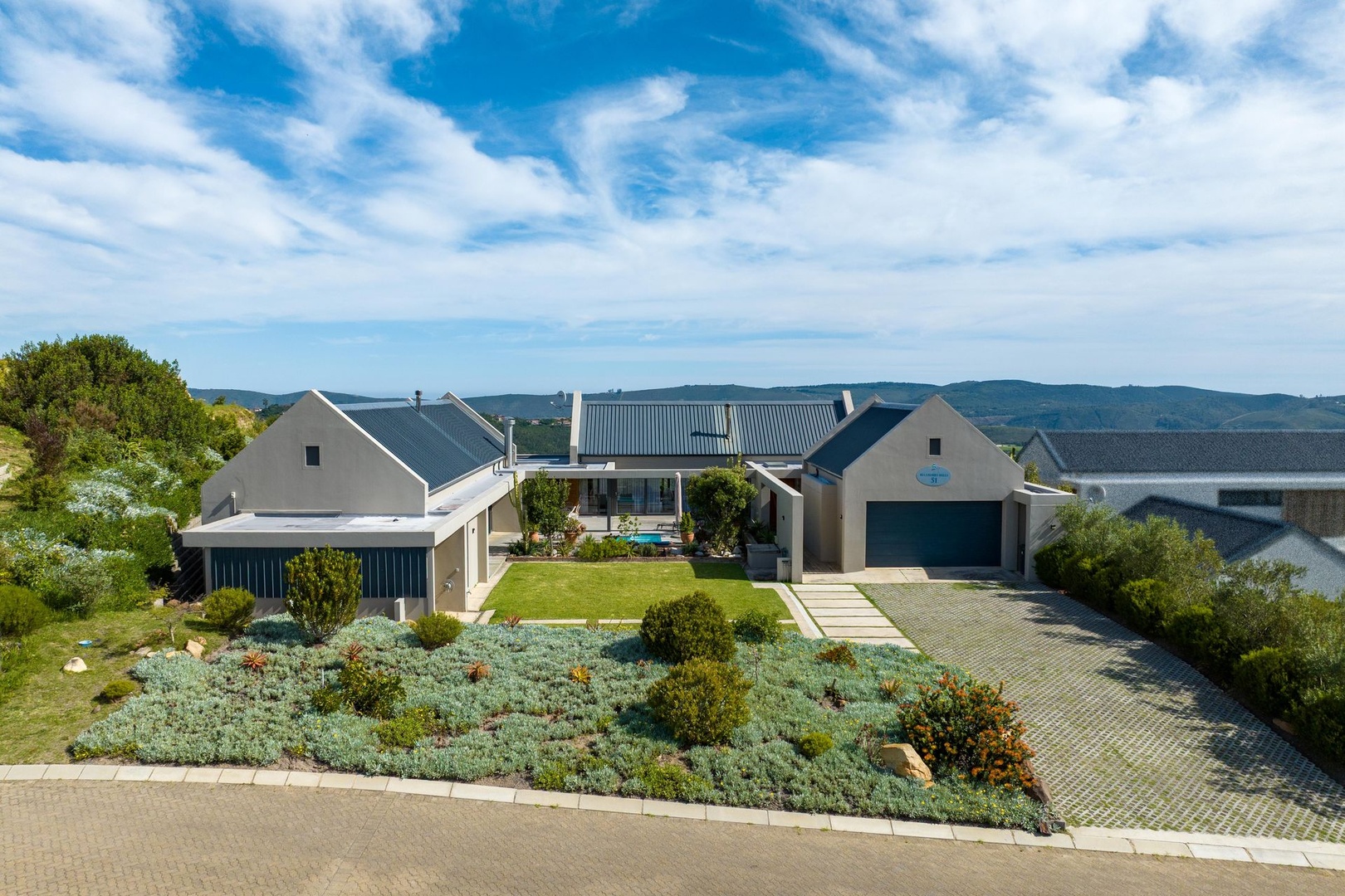 Charming Modern Industrial Farm Home with Panoramic River & Mountain Views