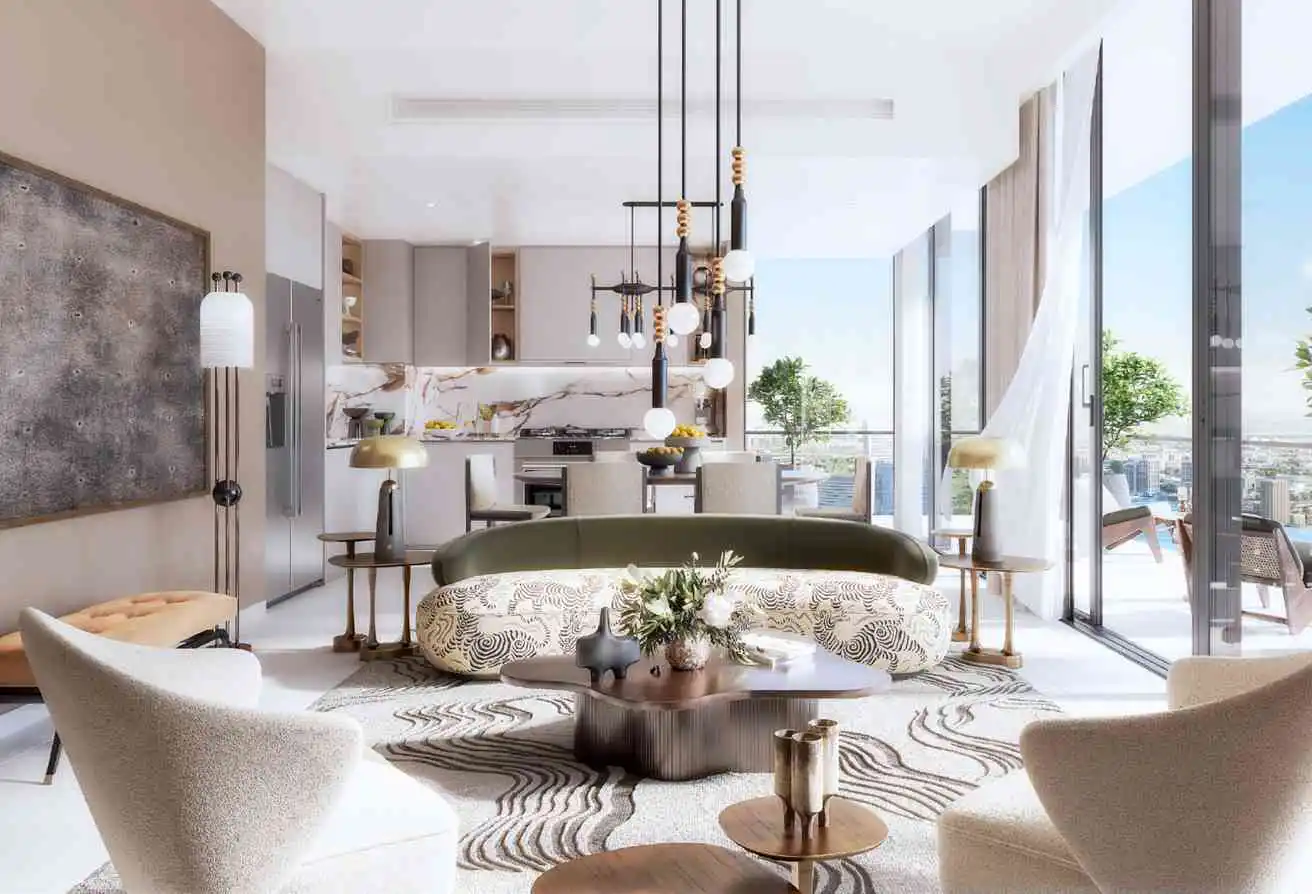 Modern open-plan living room with a curved patterned sofa, beige armchairs, and a kitchen with marble backsplash.