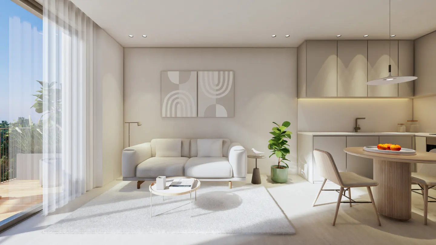 Bright, modern apartment interior with a white sofa, round table, and kitchen area. Neutral tones and natural light create a serene atmosphere.