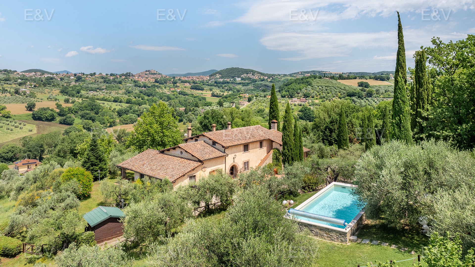 An elegant farmhouse set amongst olive trees and rolling hills, overlooking Amelia