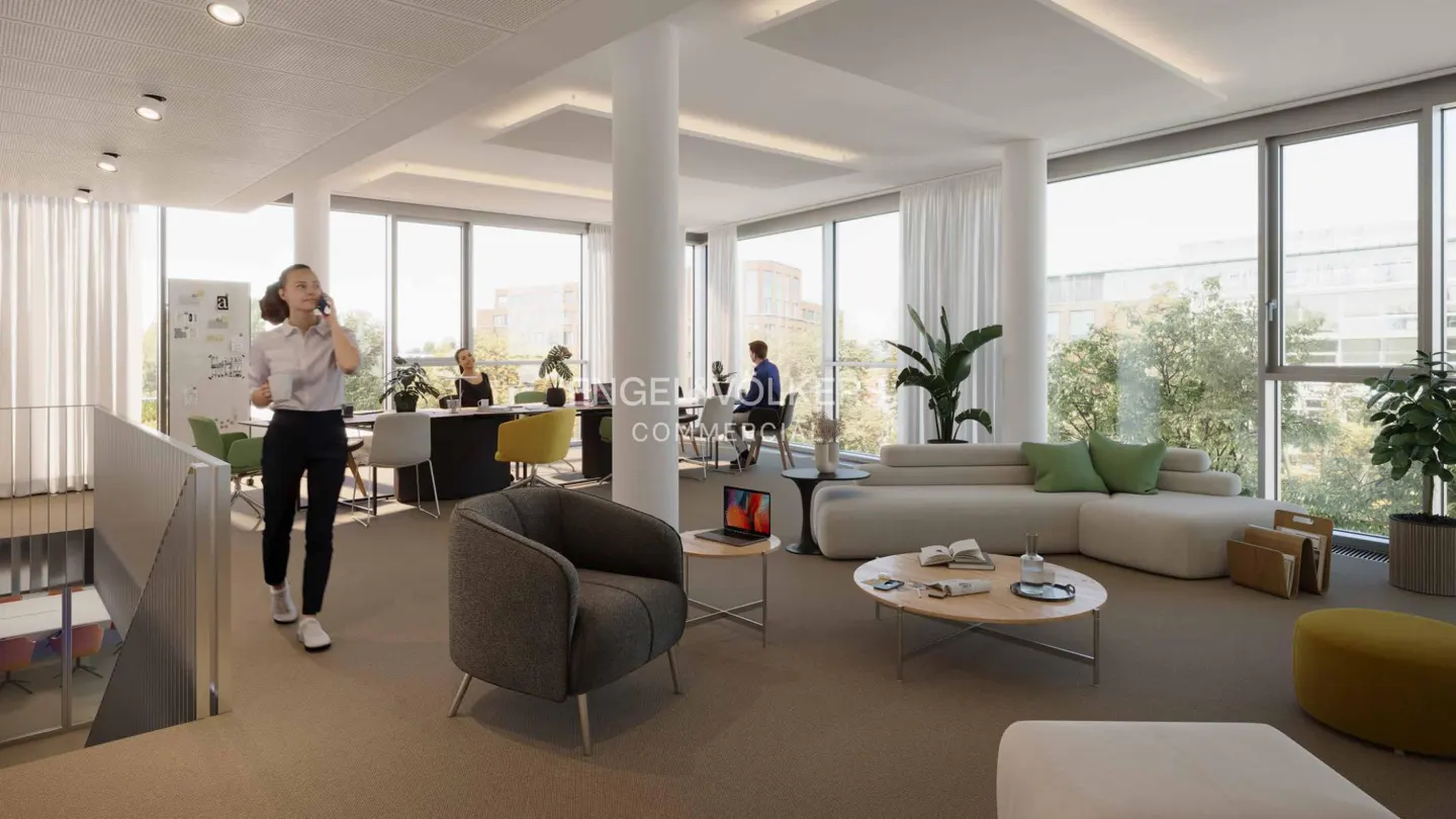 Bright, modern office space with large windows, a white sofa, and a woman walking while talking on her phone.