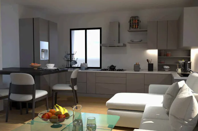 A modern kitchen and living room area with gray cabinets, white sofa, and a glass table with fruit.