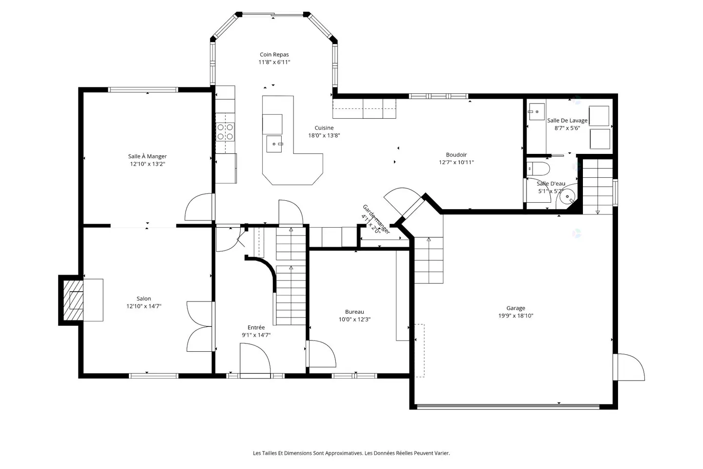 Black and white floor plan of a house, including a salon, dining room, kitchen, and garage.