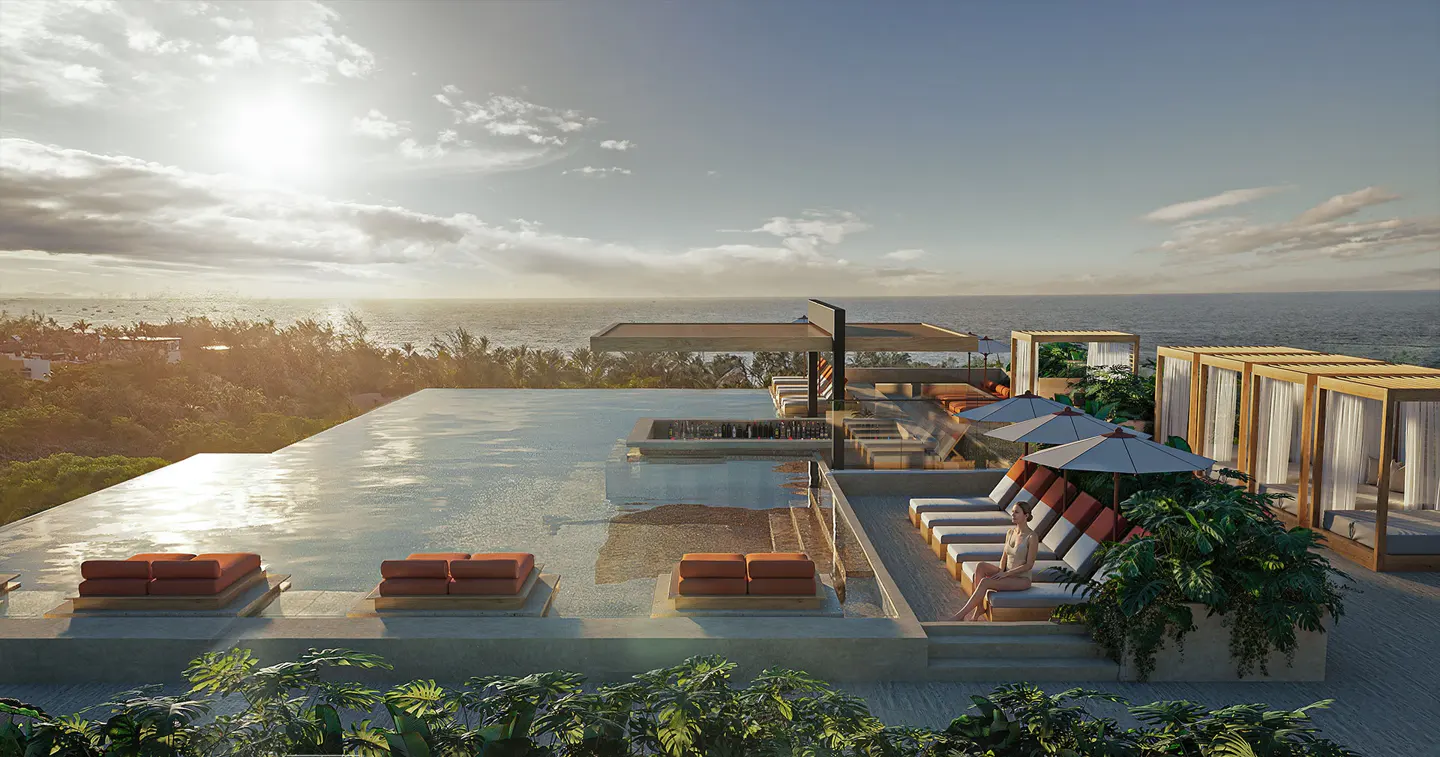 Infinity pool at sunset with orange lounge chairs, cabanas, and a person relaxing by the ocean view.