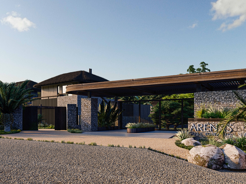 Exterior view of Arenas Jose Ignacio, a luxury property with stone walls, dark wood accents, and lush landscaping.