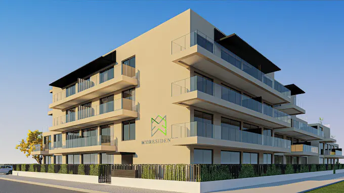 Modern beige apartment building with glass balconies, black awnings, and a green logo on the side. Blue sky background.