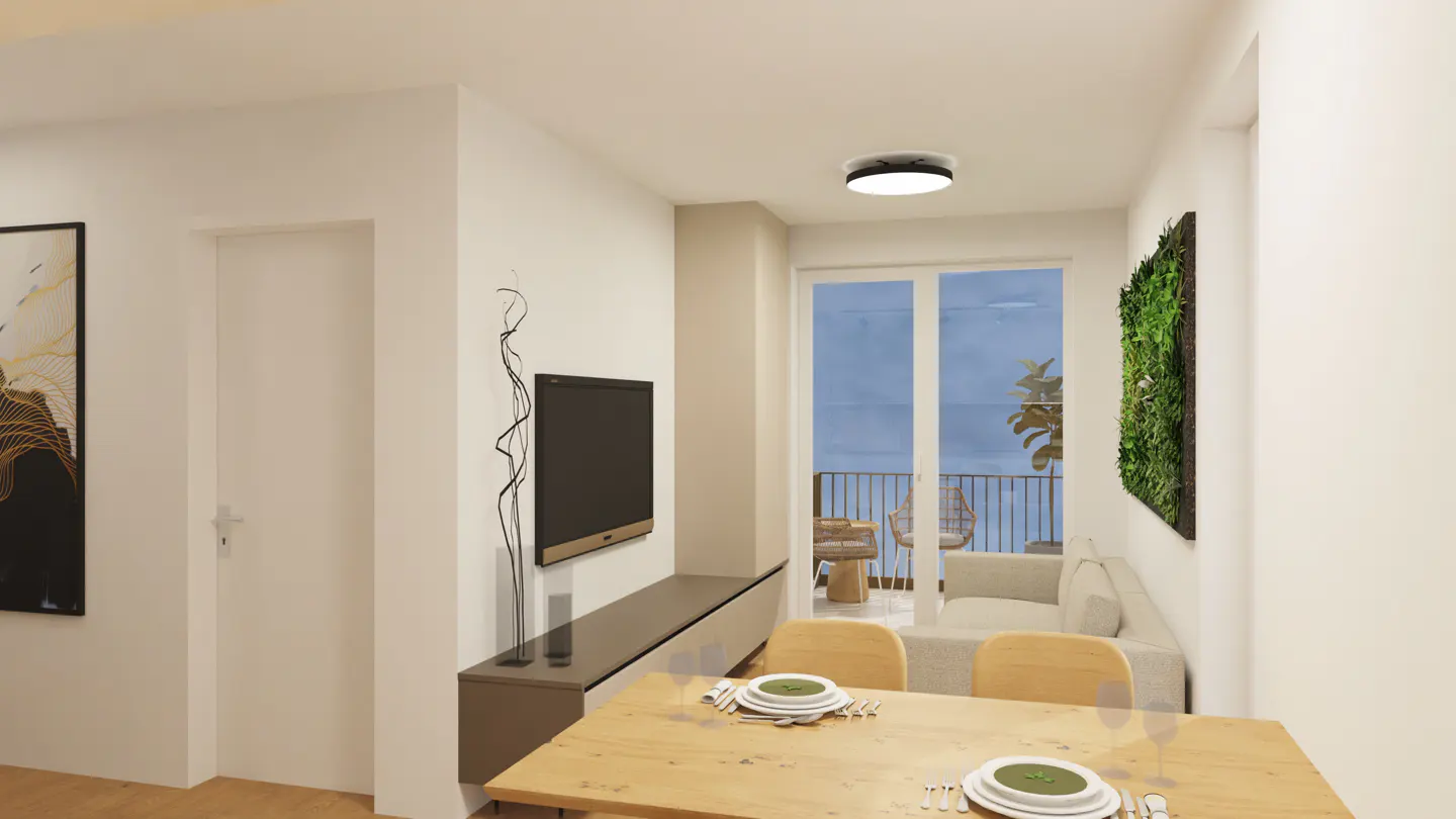 Living room with a wooden dining table set for a meal, a TV, and a balcony with outdoor furniture.