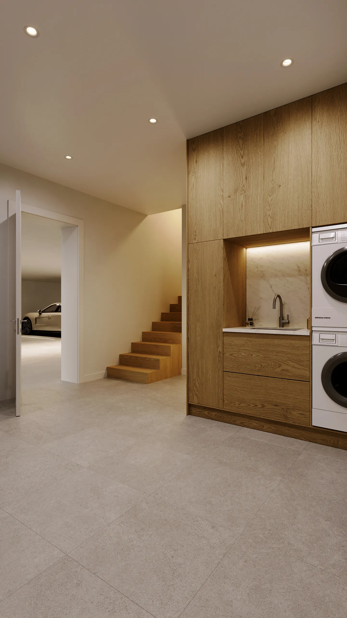 A modern, open-concept laundry room with light wood cabinets, a sink, and stacked washer/dryer units. Stairs and a garage with a car are visible.
