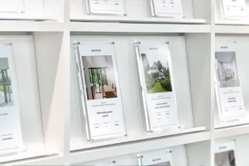 Real estate exposes on a shelf