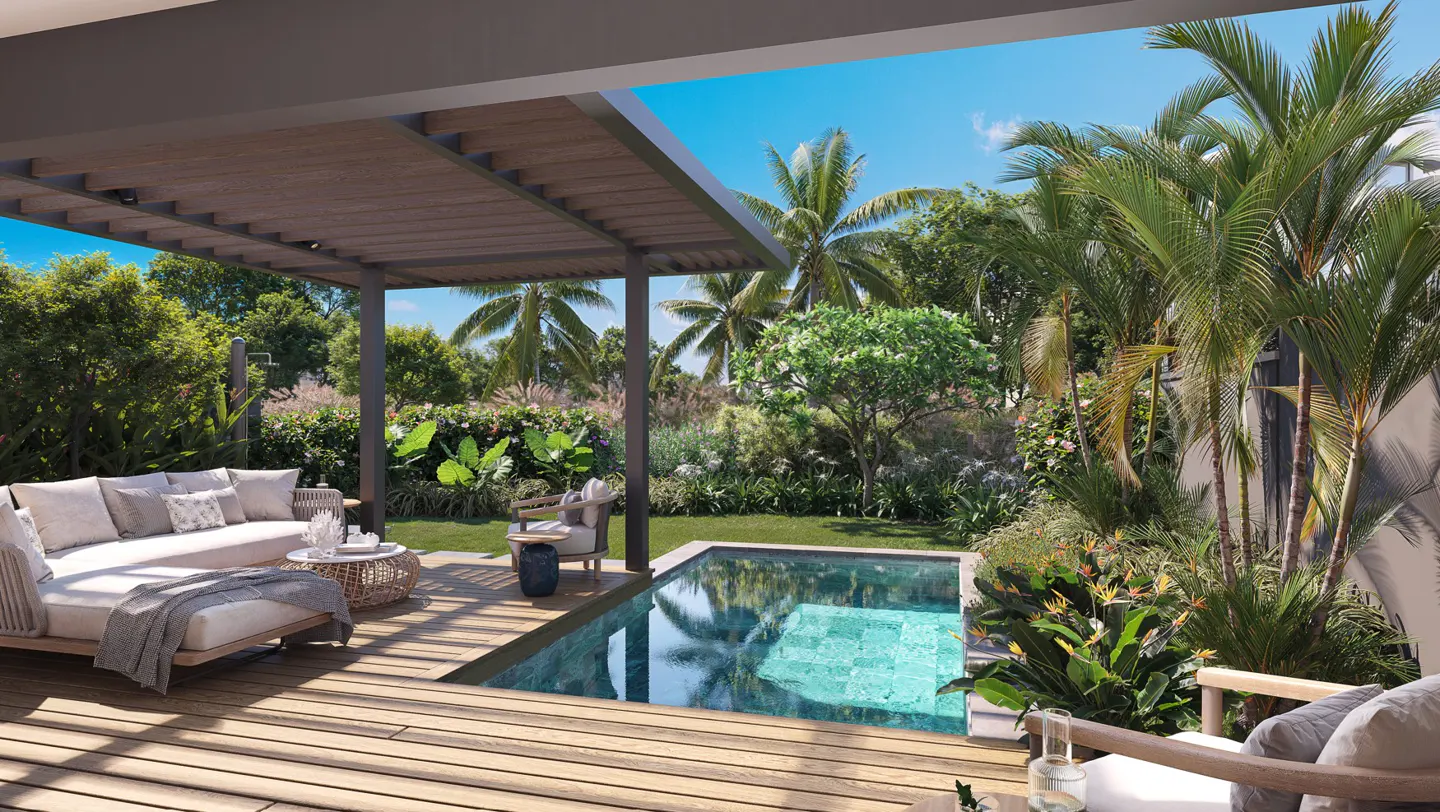 Outdoor patio with a small pool surrounded by lush greenery. A sofa and chairs sit on a wooden deck under a pergola.