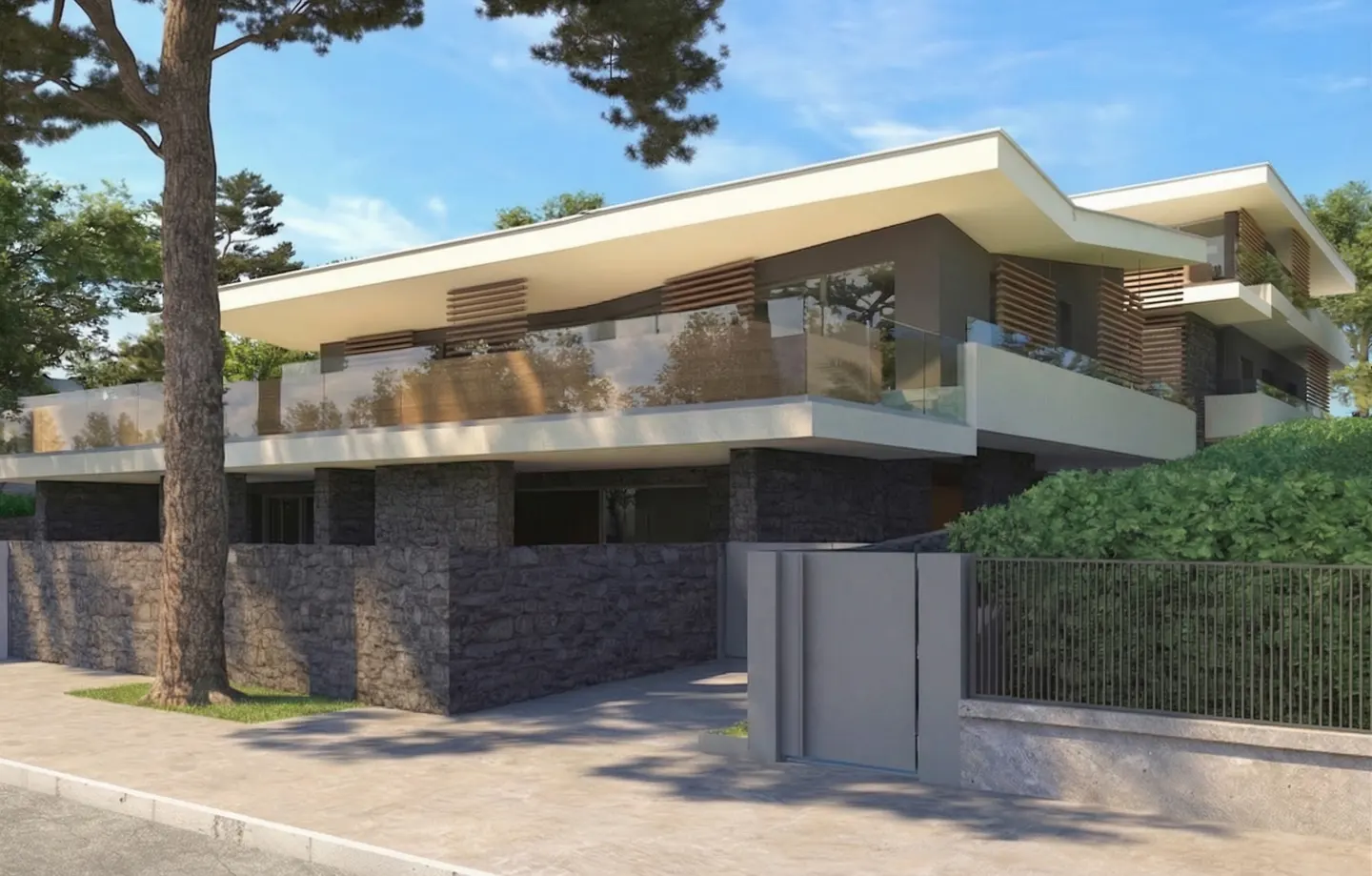 Modern two-story house with stone facade, white roof, and glass balconies. Trees surround the property, and a gray fence lines the sidewalk.