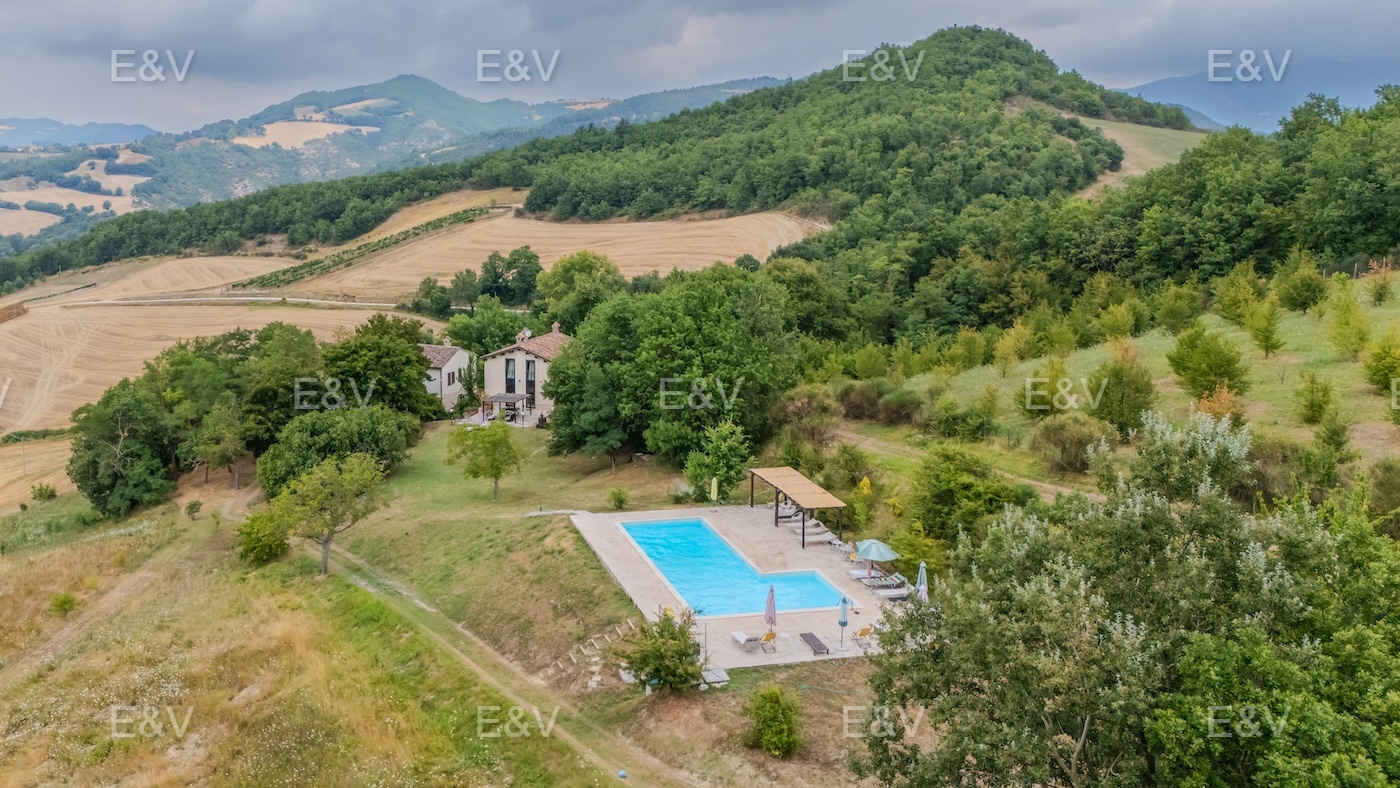 Typical farmhouse with barn in the hills of Cagli